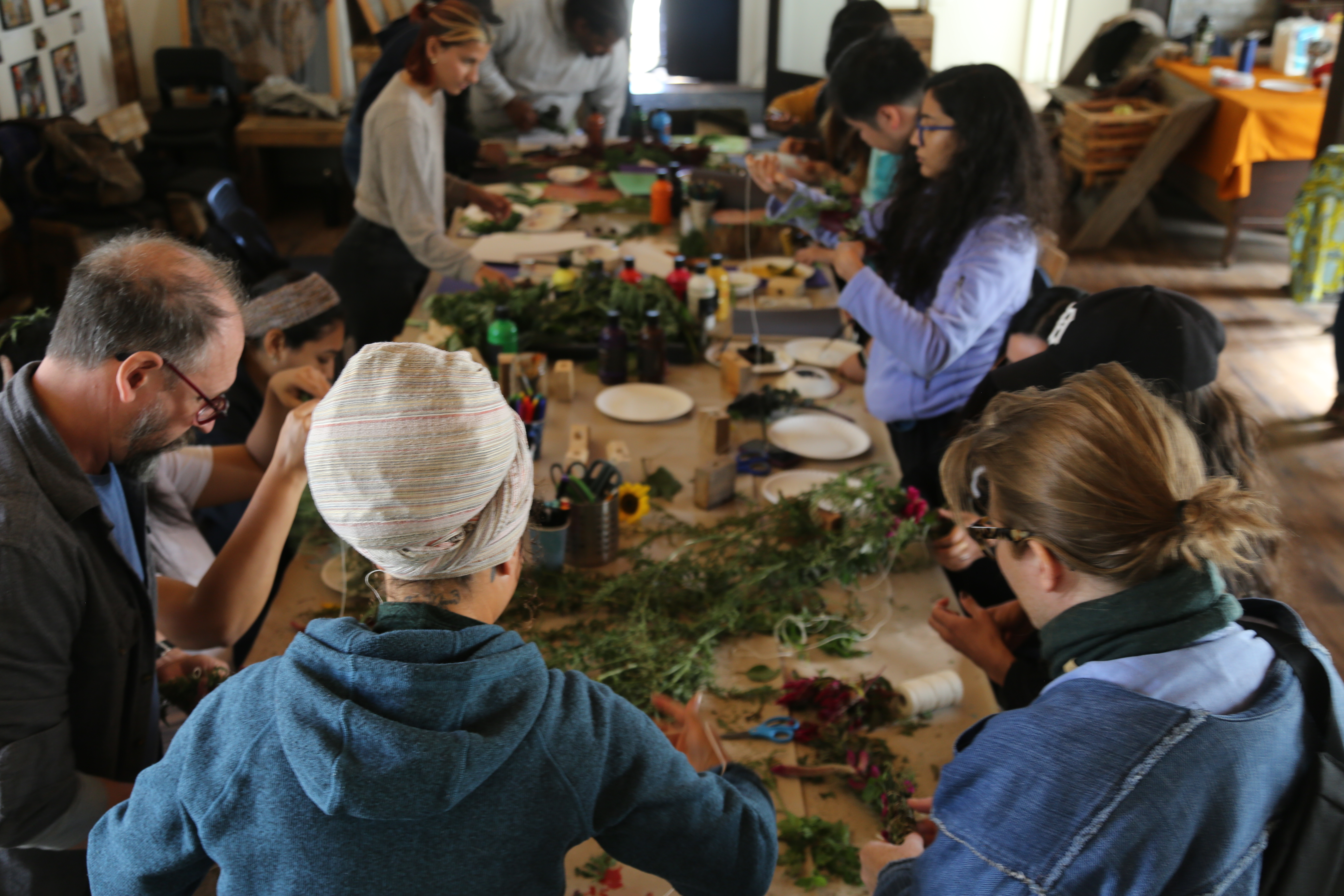 A group gathers around a table