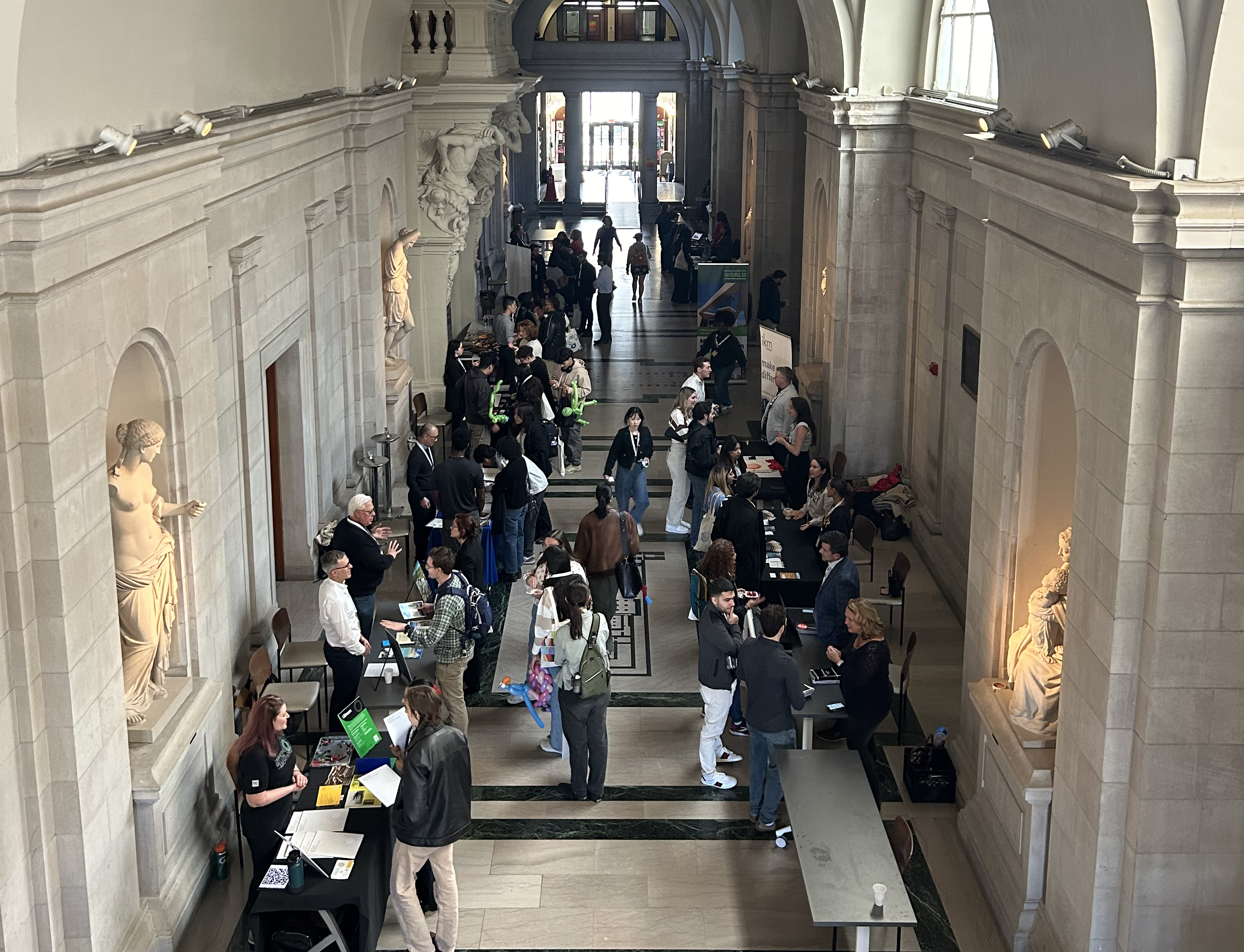 a crowd of people at a career fair