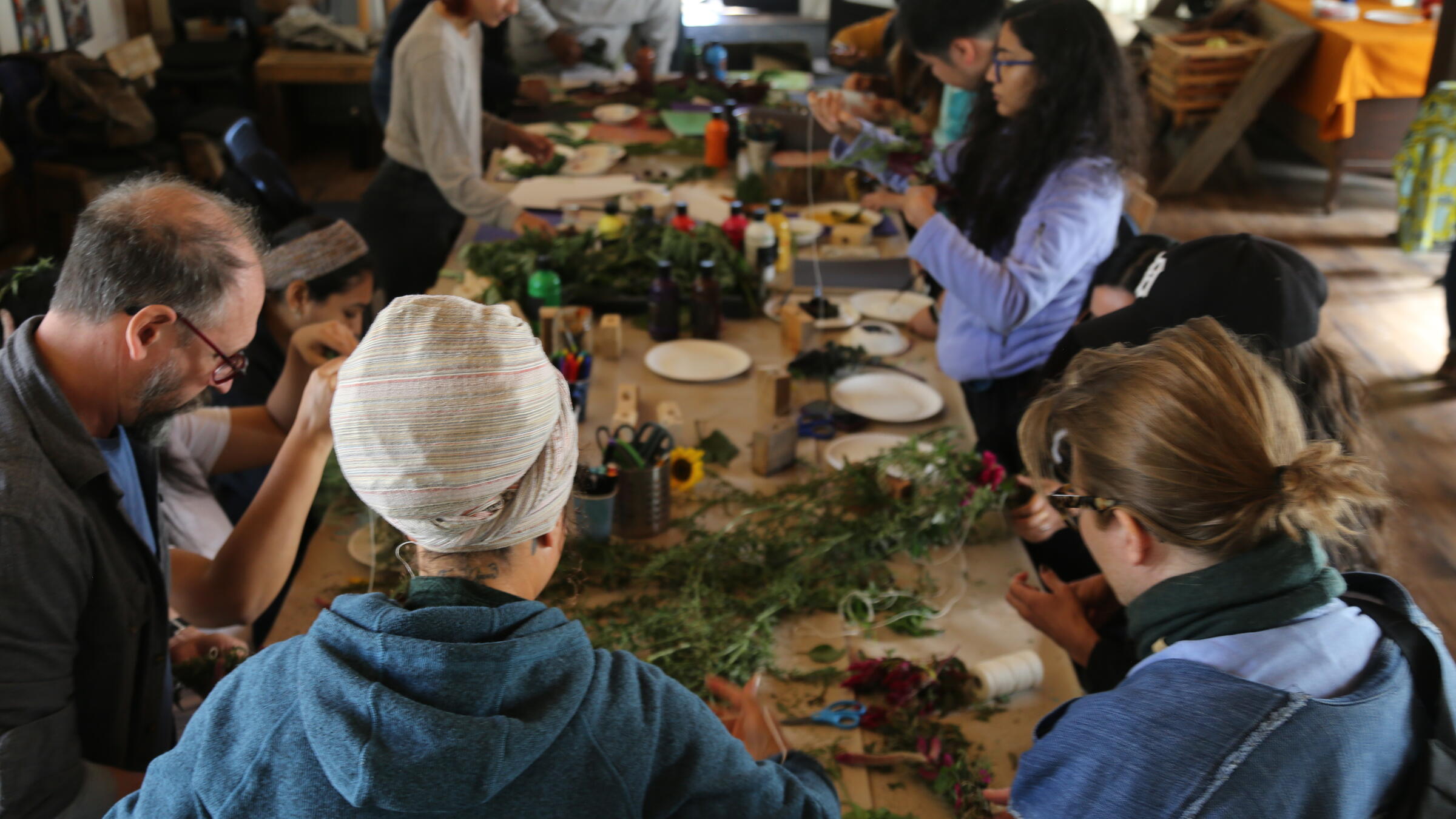 A group gathers around a table