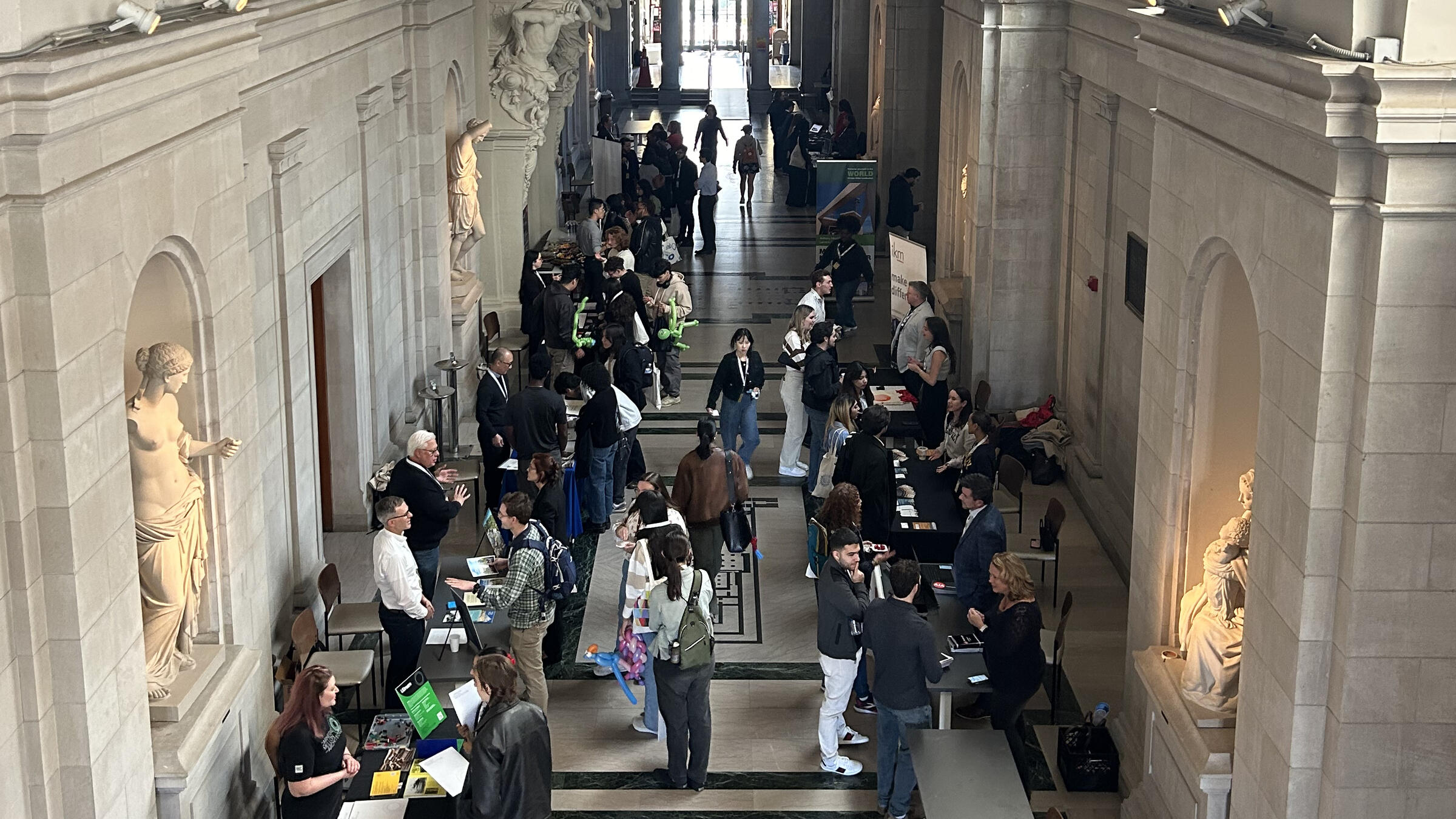 a crowd of people at a career fair