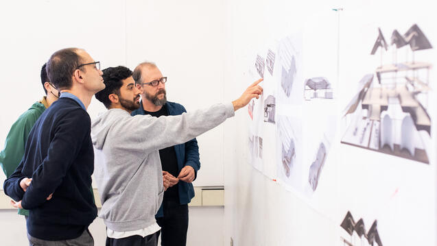M.Arch students and professors discuss a pin-up
