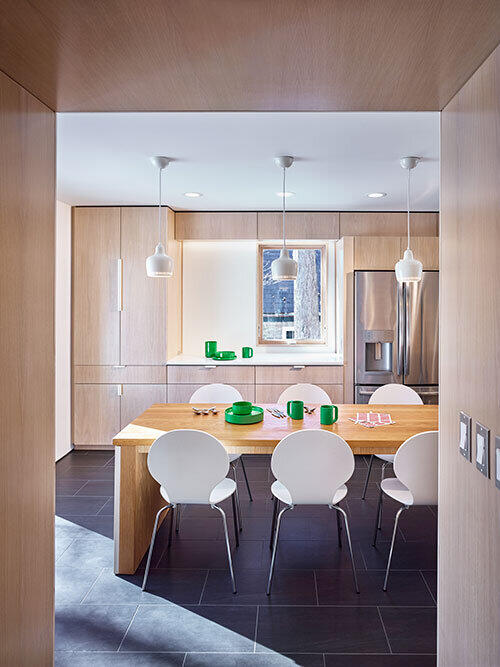 Studio d’ARC transformed a separate kitchen and formal dining room into a spacious, Scandinavian-inspired space. Photo by Ed Massery.