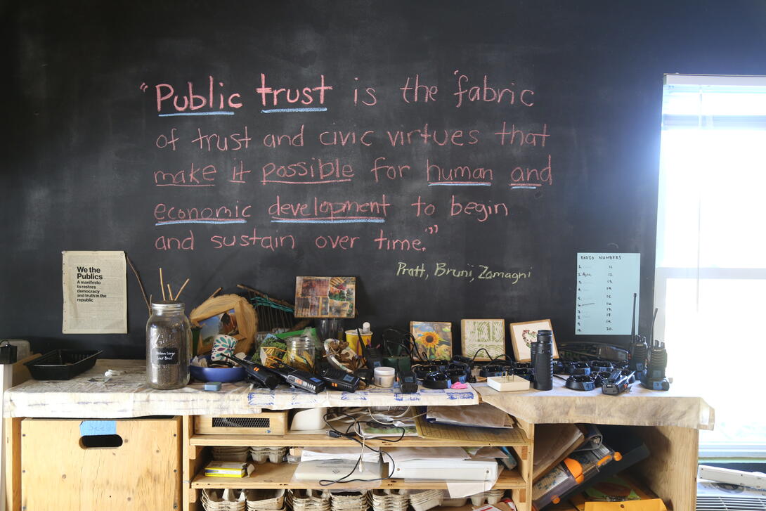 quotation written on a chalboard. "public trust is the fabric of trust and civic virtues that make it possible for human and economic development to begin and sustain over time.